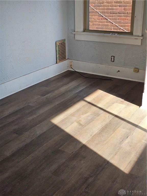 4009 E 3rd St, Dayton, OH 45403 - empty room featuring wood finished floors and a textured wall