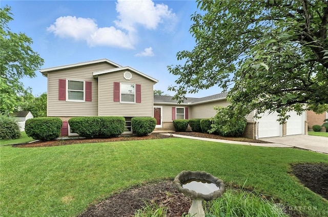 51 Jill Dr, Germantown, OH 45327 - tri-level home featuring driveway, a front yard, brick siding, and a garage