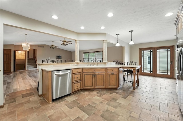 51 Jill Dr, Germantown, OH 45327 - kitchen with stainless steel dishwasher, light countertops, a kitchen breakfast bar, pendant lighting, and recessed lighting
