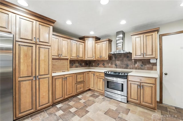 51 Jill Dr, Germantown, OH 45327 - kitchen featuring appliances with stainless steel finishes, wall chimney exhaust hood, stone finish flooring, light countertops, and tasteful backsplash