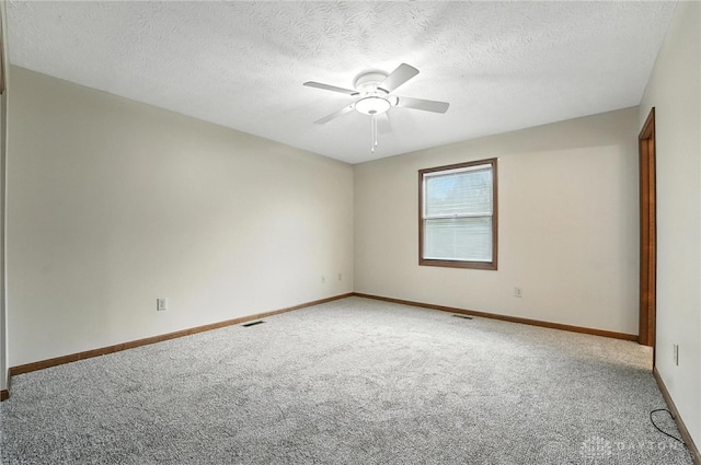 51 Jill Dr, Germantown, OH 45327 - unfurnished room with carpet flooring, a ceiling fan, and a textured ceiling