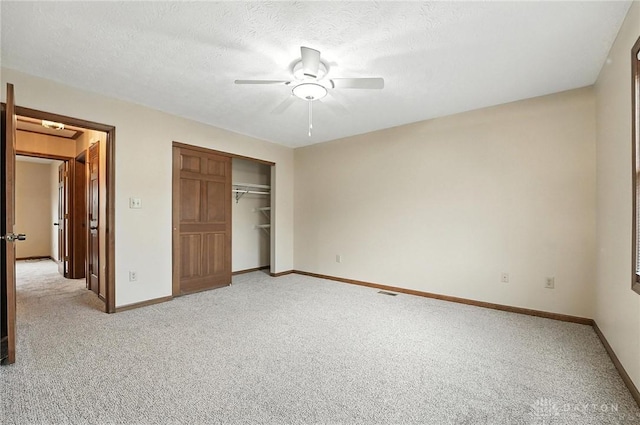 51 Jill Dr, Germantown, OH 45327 - unfurnished bedroom with light colored carpet, a closet, a ceiling fan, and a textured ceiling