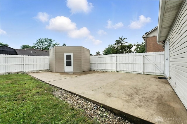 51 Jill Dr, Germantown, OH 45327 - fenced backyard featuring a patio and an outbuilding