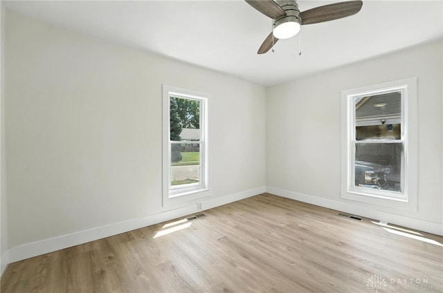 804 S Walnut St, Troy, OH 45373 - empty room featuring light wood finished floors and ceiling fan