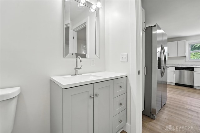 804 S Walnut St, Troy, OH 45373 - bathroom featuring vanity and wood finished floors
