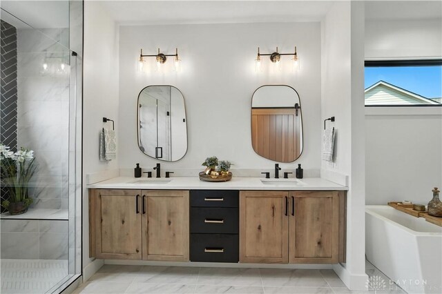 1241 Normandy Rue, Centerville, OH 45458 - bathroom with double vanity, a shower stall, and a tub
