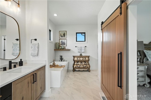 1241 Normandy Rue, Centerville, OH 45458 - full bathroom with vanity, a freestanding bath, recessed lighting, and marble look tiles