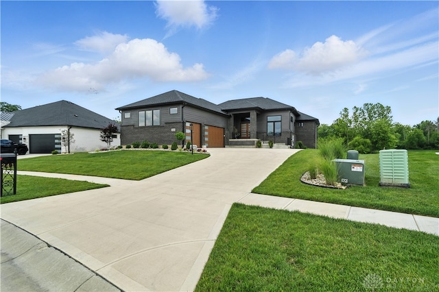 1241 Normandy Rue, Centerville, OH 45458 - view of front of property with brick siding, concrete driveway, a front lawn, and an attached garage