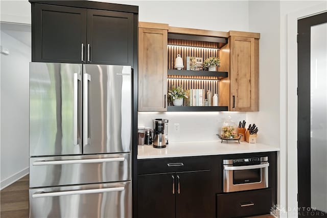 1241 Normandy Rue, Centerville, OH 45458 - kitchen with appliances with stainless steel finishes, open shelves, light countertops, and wood finished floors