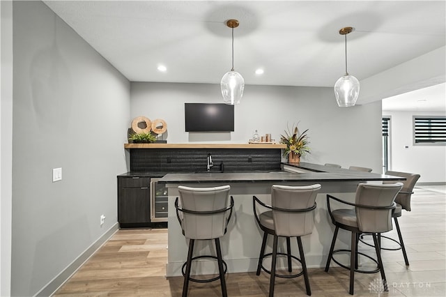 1241 Normandy Rue, Centerville, OH 45458 - indoor wet bar with decorative light fixtures, recessed lighting, and light wood finished floors