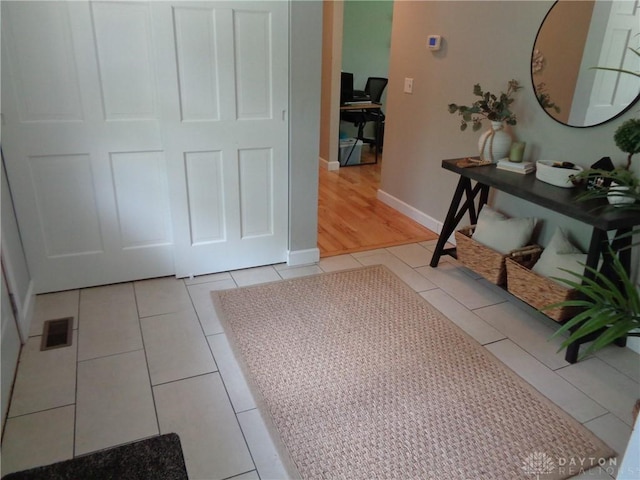 12071 Oxford Rd, Germantown, OH 45327 - corridor featuring light tile patterned flooring and baseboards