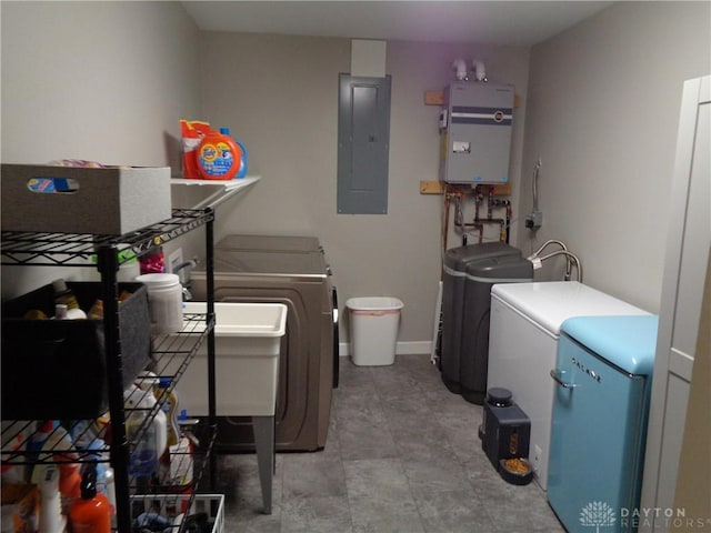12071 Oxford Rd, Germantown, OH 45327 - washroom with electric panel, washer and clothes dryer, and tankless water heater
