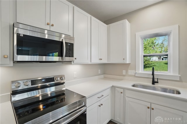 3384 Randall Dr, Cedarville Twp, OH 45314 - kitchen with appliances with stainless steel finishes, white cabinetry, and light countertops