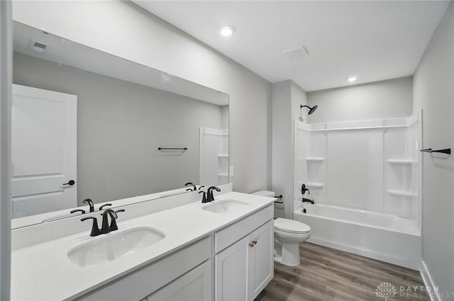 3384 Randall Dr, Cedarville Twp, OH 45314 - bathroom featuring wood finished floors, double vanity, shower / bath combination, and recessed lighting