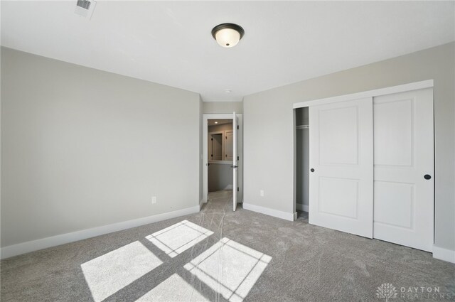 3384 Randall Dr, Cedarville Twp, OH 45314 - unfurnished bedroom featuring carpet floors and a closet