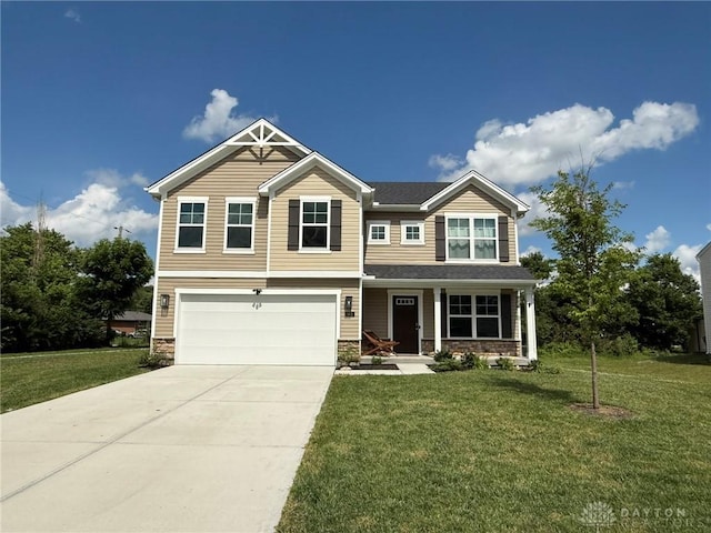 562 Maxwell Ct, Germantown, OH 45327 - craftsman-style house featuring concrete driveway, an attached garage, stone siding, a front lawn, and a porch