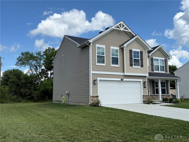 562 Maxwell Ct, Germantown, OH 45327 - view of front of home with a garage, a front yard, driveway, a porch, and stone siding