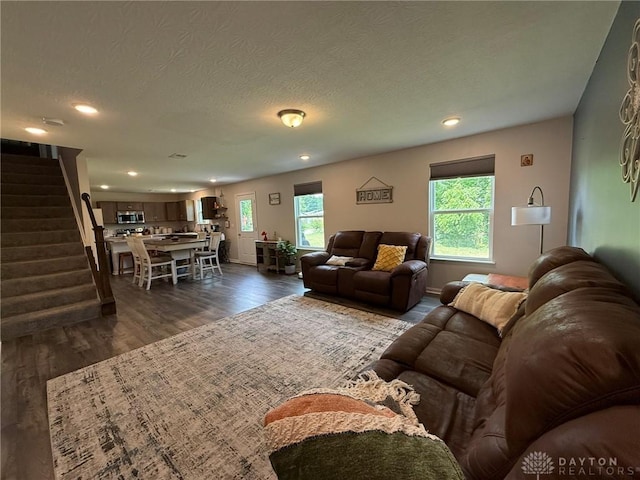 562 Maxwell Ct, Germantown, OH 45327 - living area with plenty of natural light, dark wood-type flooring, stairs, recessed lighting, and a textured ceiling