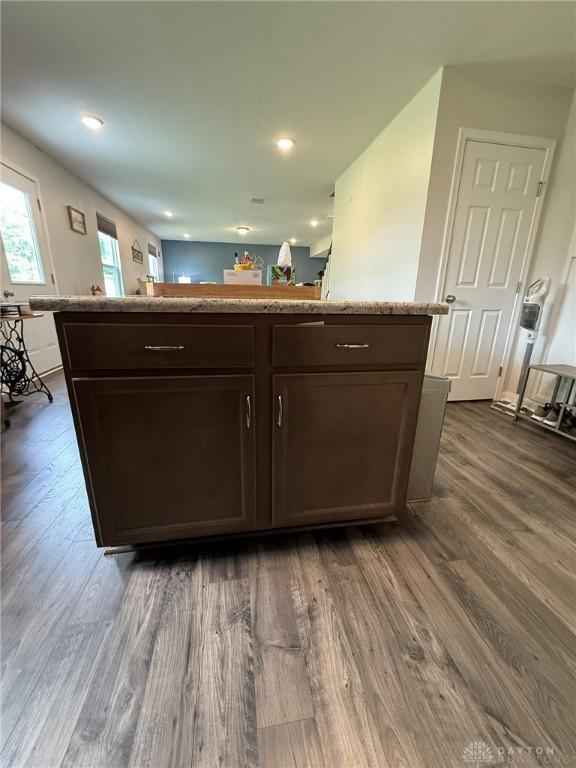 562 Maxwell Ct, Germantown, OH 45327 - kitchen featuring dark wood finished floors, dark brown cabinets, a kitchen island, and recessed lighting