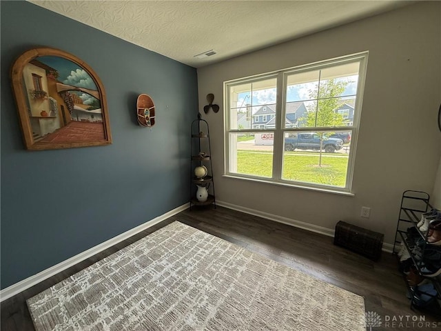 562 Maxwell Ct, Germantown, OH 45327 - spare room with dark wood-style flooring and a textured ceiling