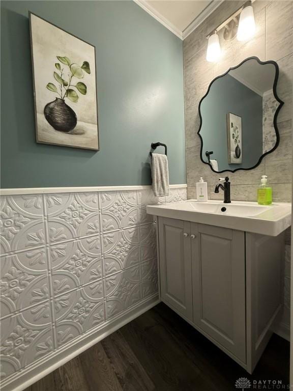 562 Maxwell Ct, Germantown, OH 45327 - bathroom featuring crown molding, vanity, wood finished floors, tile walls, and wainscoting