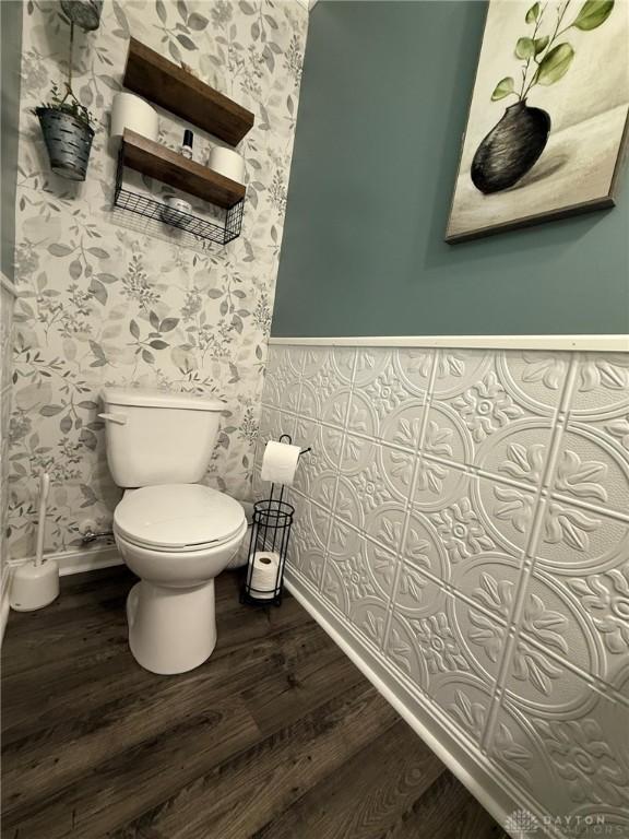 562 Maxwell Ct, Germantown, OH 45327 - half bathroom with wallpapered walls and wood finished floors