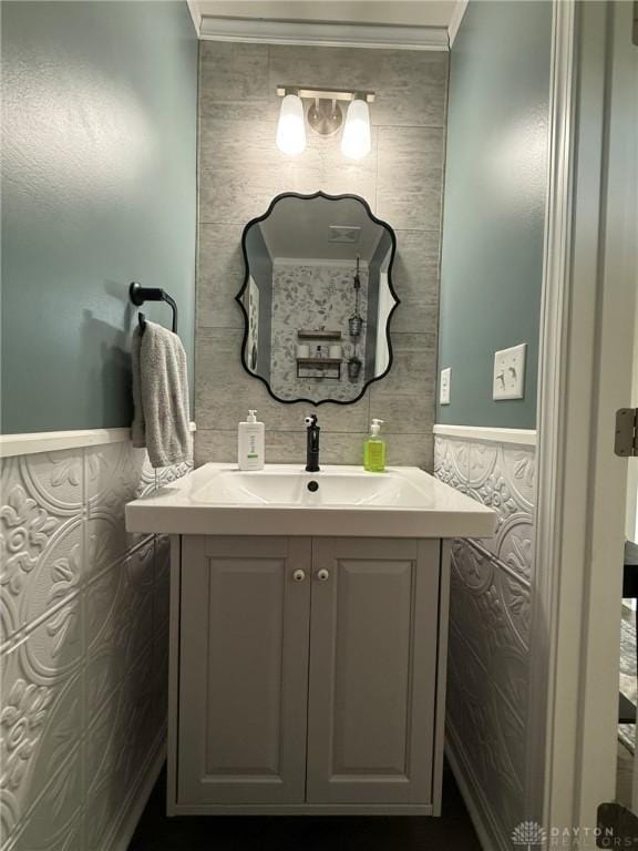 562 Maxwell Ct, Germantown, OH 45327 - bathroom with vanity, ornamental molding, wainscoting, and tile walls