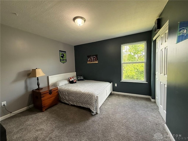 562 Maxwell Ct, Germantown, OH 45327 - carpeted bedroom featuring a closet and a textured ceiling