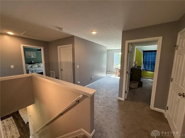 562 Maxwell Ct, Germantown, OH 45327 - hallway featuring an upstairs landing and dark carpet
