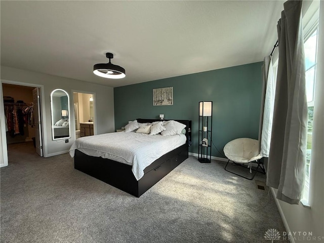 562 Maxwell Ct, Germantown, OH 45327 - carpeted bedroom with a spacious closet, a closet, and connected bathroom