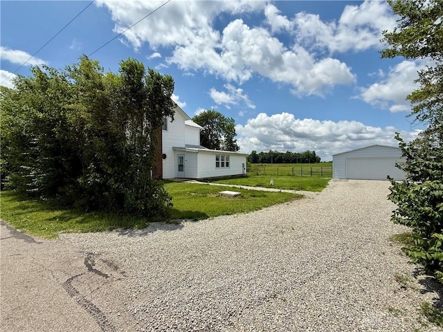 10995 Rockridge Rd, Lewisburg, OH 45338 - view of side of home featuring an outdoor structure and a garage