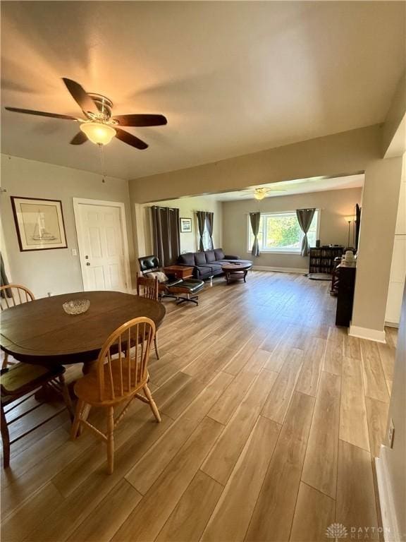 10995 Rockridge Rd, Lewisburg, OH 45338 - dining area with light wood-style floors and ceiling fan
