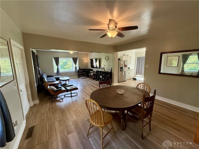 10995 Rockridge Rd, Lewisburg, OH 45338 - dining space with light wood-style floors and a ceiling fan