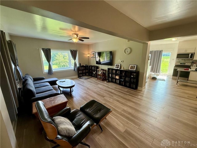 10995 Rockridge Rd, Lewisburg, OH 45338 - living area with light wood finished floors and a ceiling fan