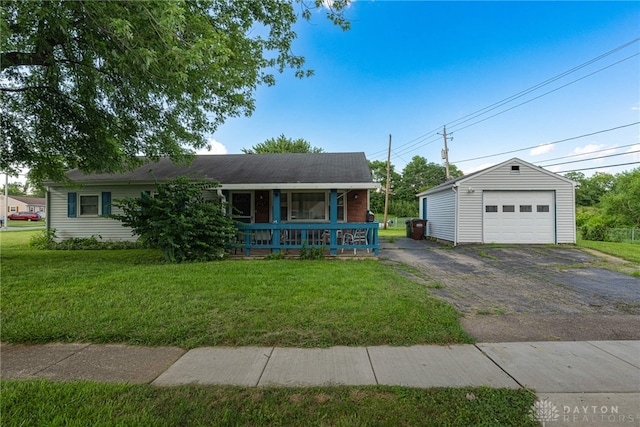2701 Mini Ct, Dayton, OH 45420 - view of front of home with a porch, a front lawn, a garage, an outdoor structure, and driveway