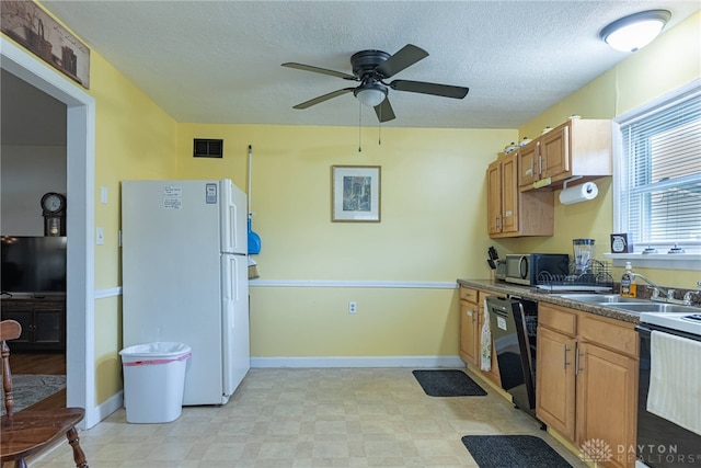2701 Mini Ct, Dayton, OH 45420 - kitchen with freestanding refrigerator, dishwasher, stainless steel microwave, a ceiling fan, and dark countertops