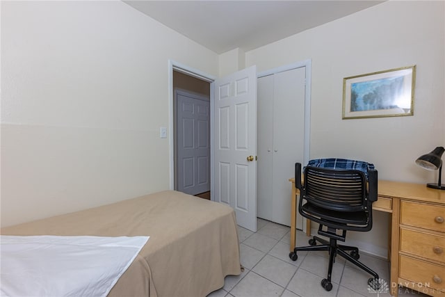 2701 Mini Ct, Dayton, OH 45420 - bedroom with a closet, light tile patterned flooring, and an office area