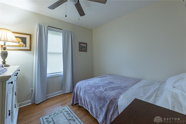 2701 Mini Ct, Dayton, OH 45420 - bedroom with wood finished floors, multiple windows, and a ceiling fan