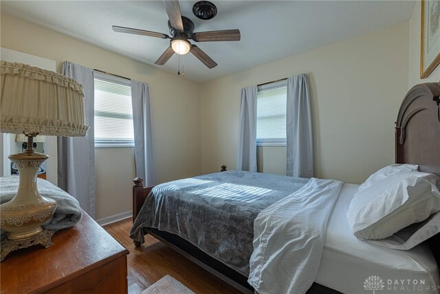 2701 Mini Ct, Dayton, OH 45420 - bedroom featuring wood finished floors, multiple windows, and a ceiling fan