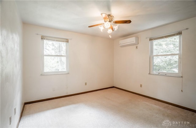 4267 W Wenger Rd, Clayton, OH 45315 - carpeted empty room with a wall unit AC and a ceiling fan