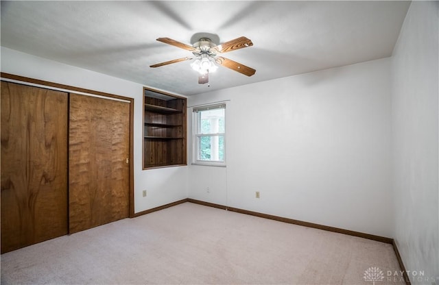 4267 W Wenger Rd, Clayton, OH 45315 - unfurnished bedroom featuring light colored carpet, a closet, and a ceiling fan