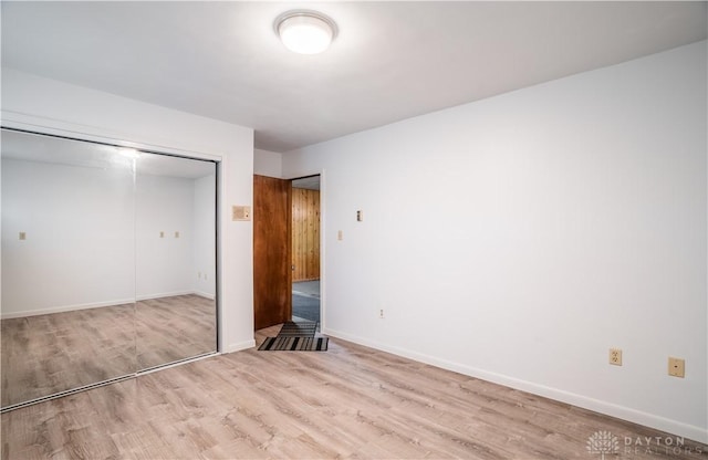 4267 W Wenger Rd, Clayton, OH 45315 - unfurnished bedroom featuring light wood finished floors and a closet