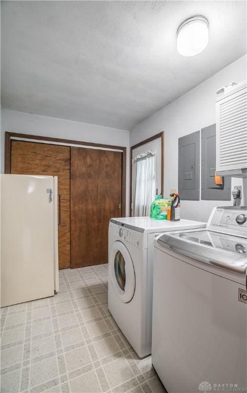 4267 W Wenger Rd, Clayton, OH 45315 - laundry area featuring separate washer and dryer, light flooring, and electric panel