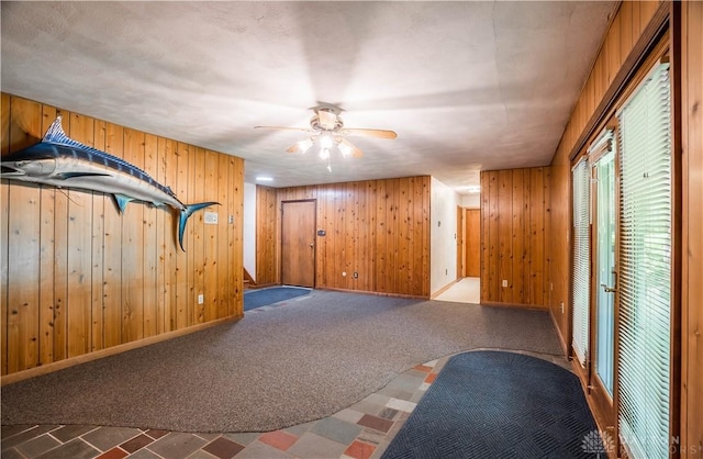 4267 W Wenger Rd, Clayton, OH 45315 - exercise room featuring wooden walls and ceiling fan