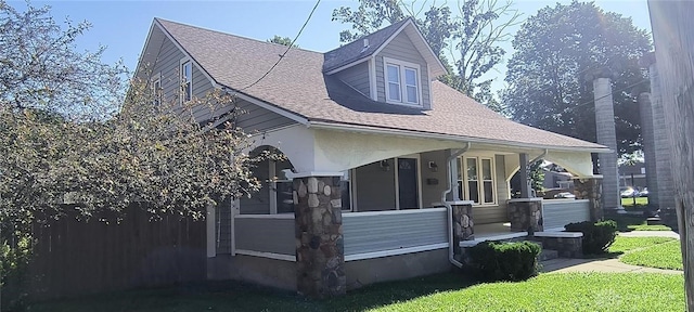 289 Dayton Ave, Xenia, OH 45385 - view of front of home with a porch, roof with shingles, and a front lawn