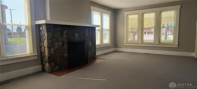 289 Dayton Ave, Xenia, OH 45385 - unfurnished living room with carpet and a fireplace