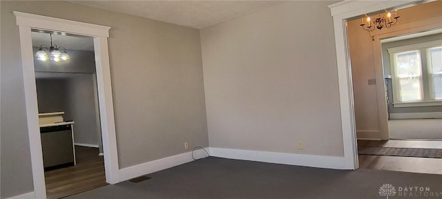 289 Dayton Ave, Xenia, OH 45385 - unfurnished bedroom with a chandelier and baseboards