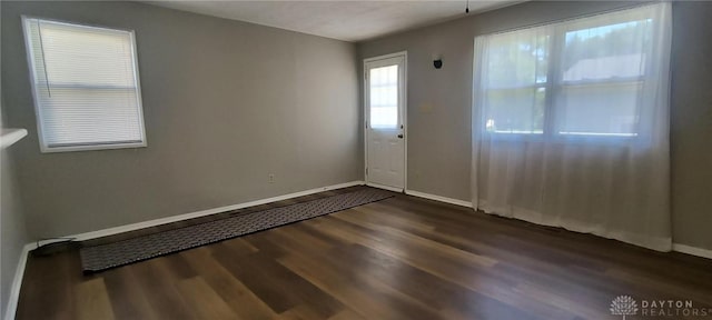 289 Dayton Ave, Xenia, OH 45385 - spare room with dark wood-style flooring and baseboards