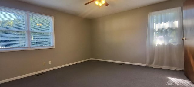 289 Dayton Ave, Xenia, OH 45385 - spare room featuring a ceiling fan and dark colored carpet