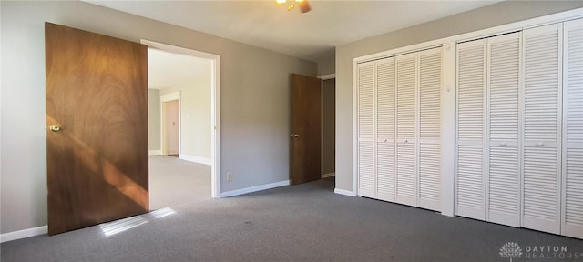 289 Dayton Ave, Xenia, OH 45385 - unfurnished bedroom with carpet floors and multiple closets